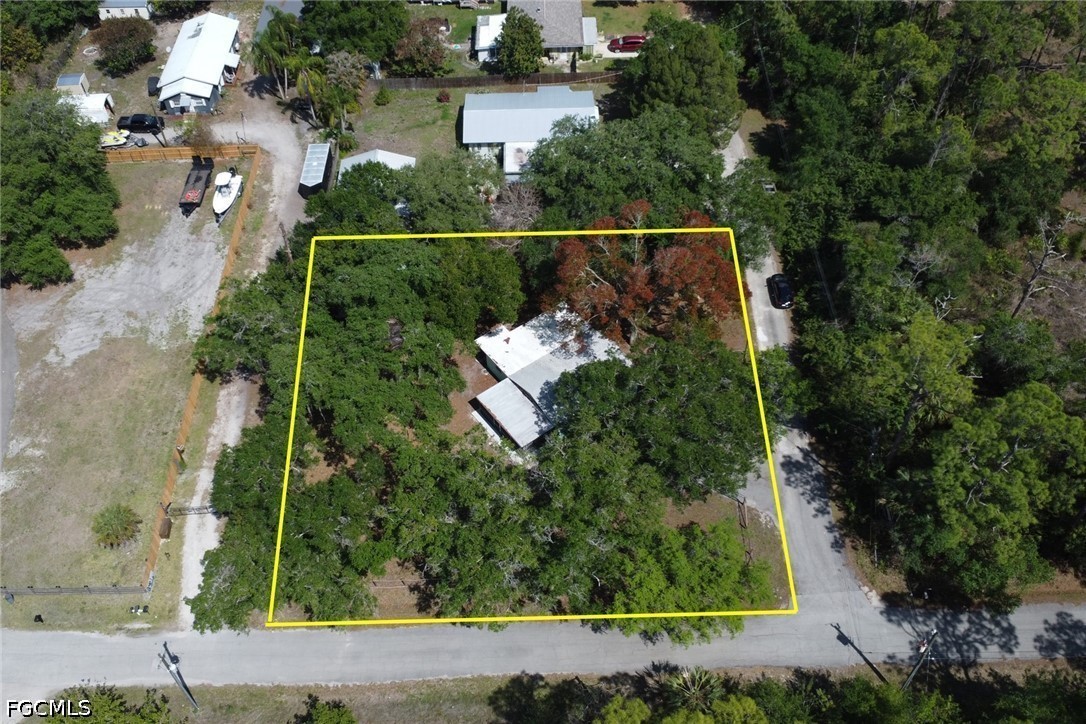 2431 Lippincott Road Alva, FL 33920 - Photo 38 of 43 an aerial view of house with yard
