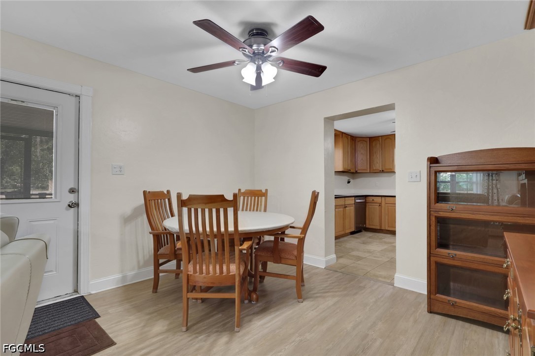 2431 Lippincott Road Alva, FL 33920 - Photo 9 of 43 a view of a dining room with furniture and wooden floor