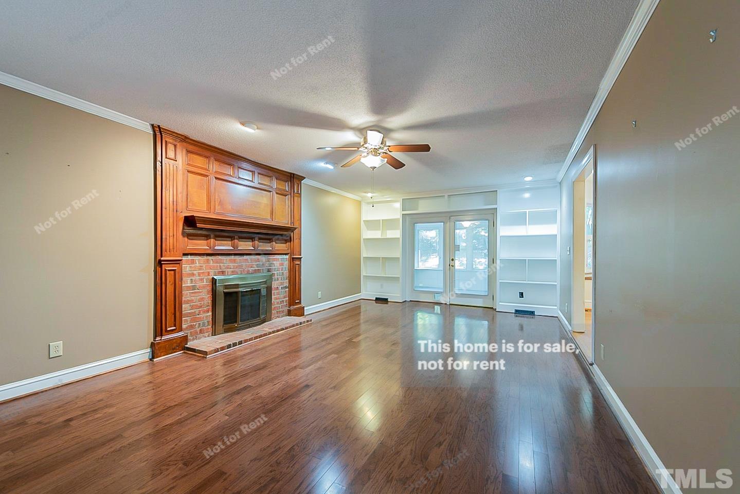8335 Morgans Way Raleigh, NC 27613 - Photo 3 of 23 a view of an empty room with window and wooden floor
