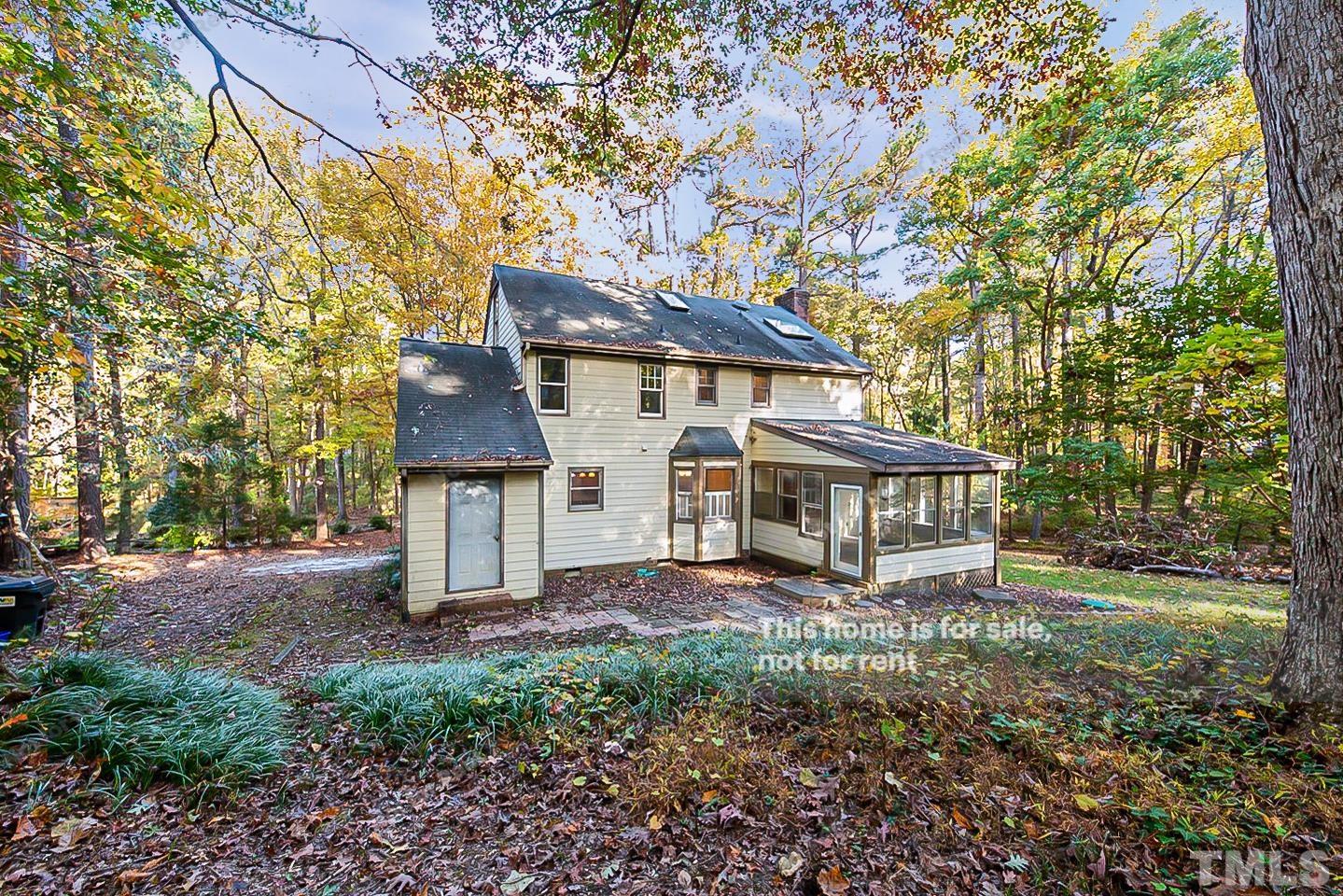 8335 Morgans Way Raleigh, NC 27613 - Photo 22 of 23 front view of a house with a tiny house