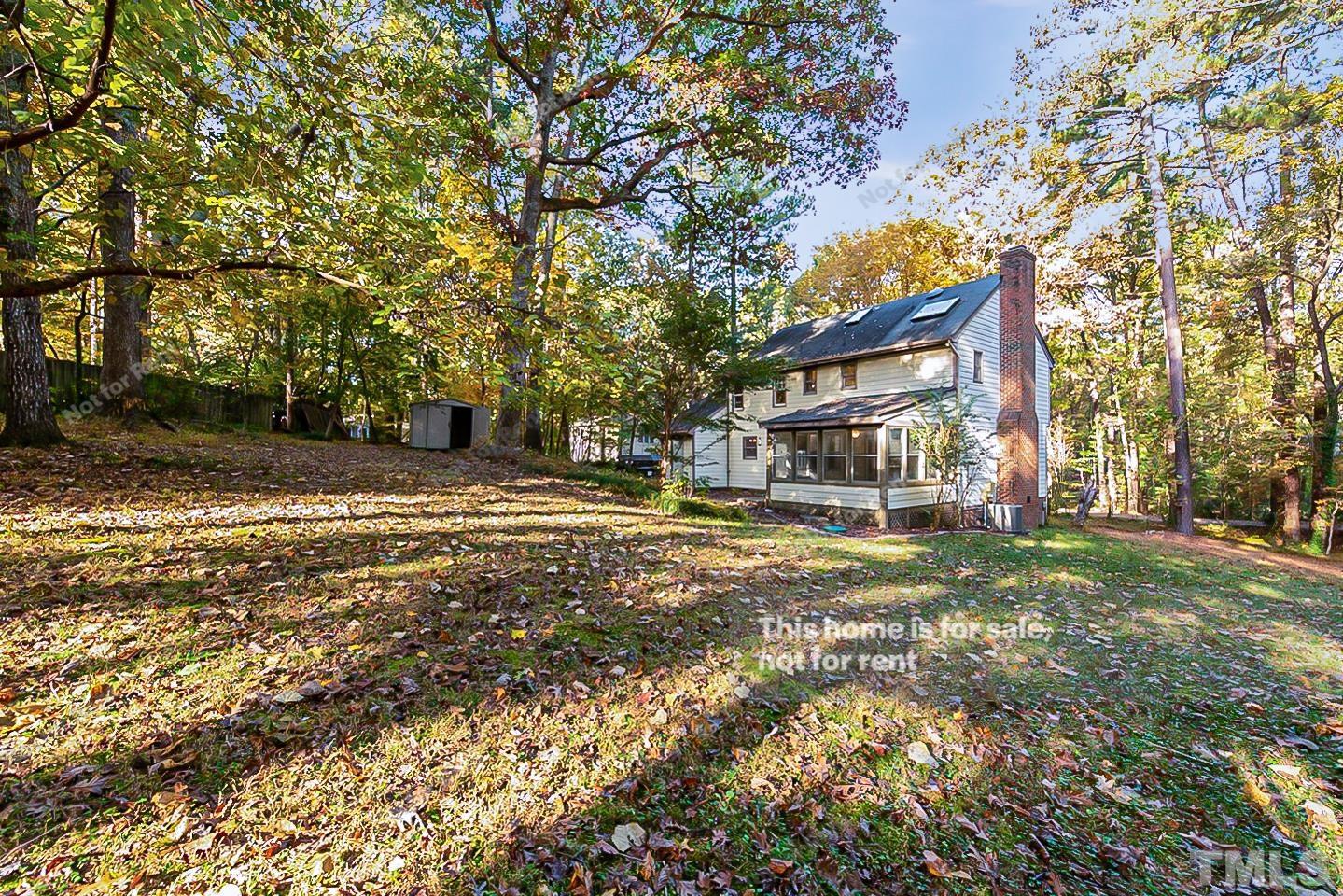 8335 Morgans Way Raleigh, NC 27613 - Photo 23 of 23 a view of a house with a yard