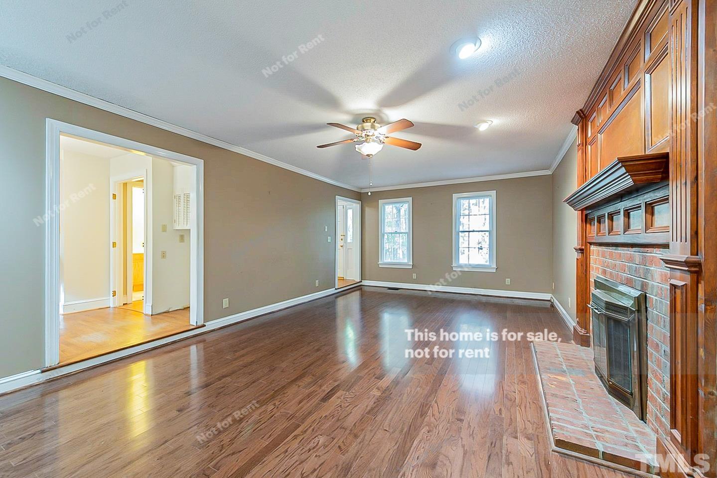 8335 Morgans Way Raleigh, NC 27613 - Photo 4 of 23 a view of an empty room with window and wooden floor