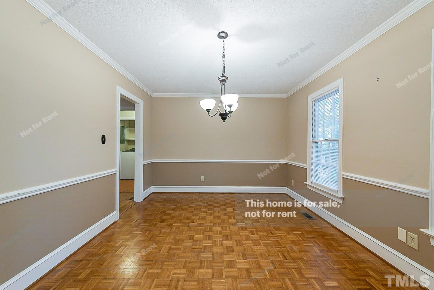 8335 Morgans Way Raleigh, NC 27613 - Photo 6 of 23 a view of a hallway with a chandelier