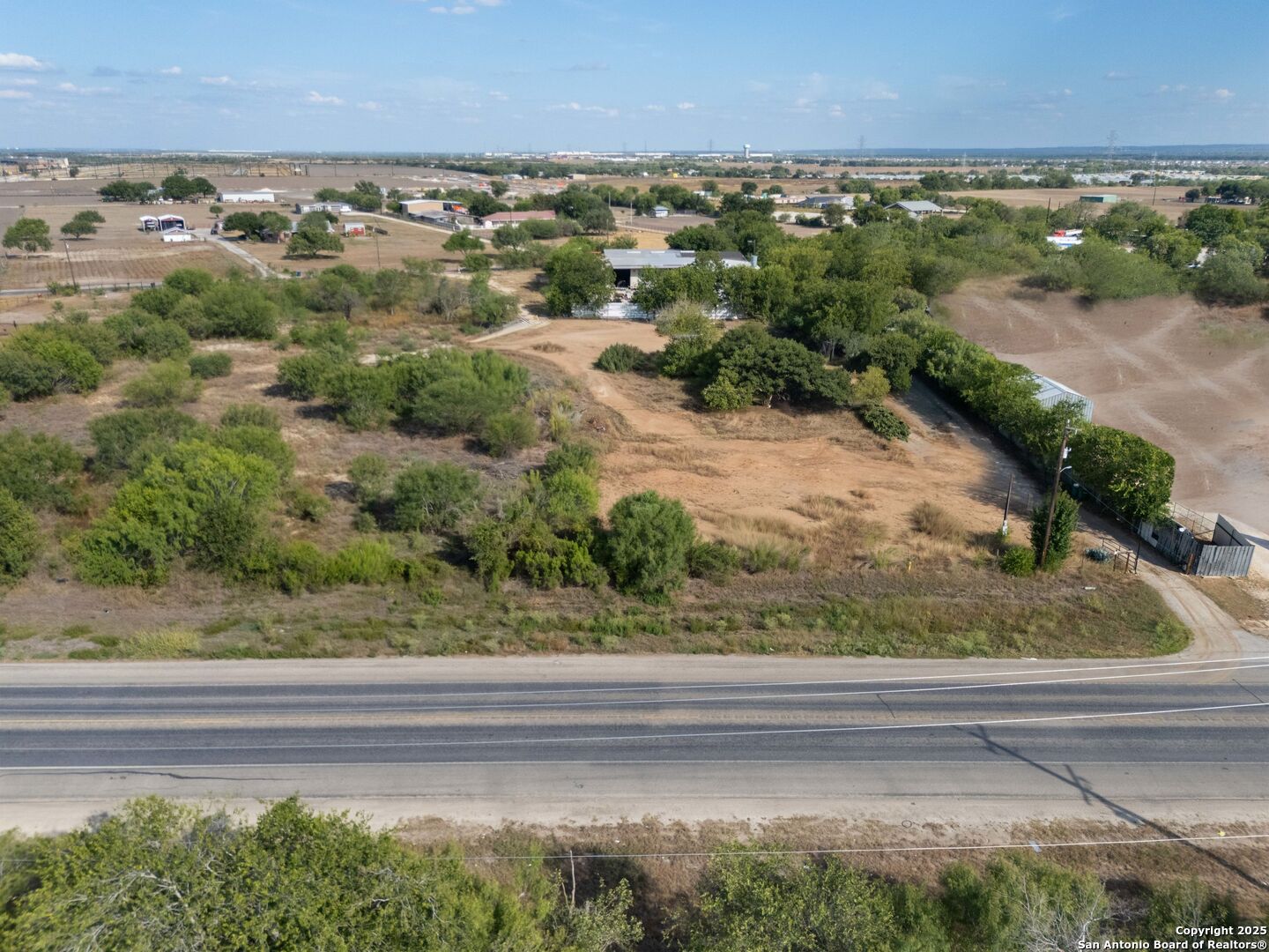 13348 Somerset Road Von Ormy, TX 78073 - Photo 3 of 13 a view of a yard with a outdoor space
