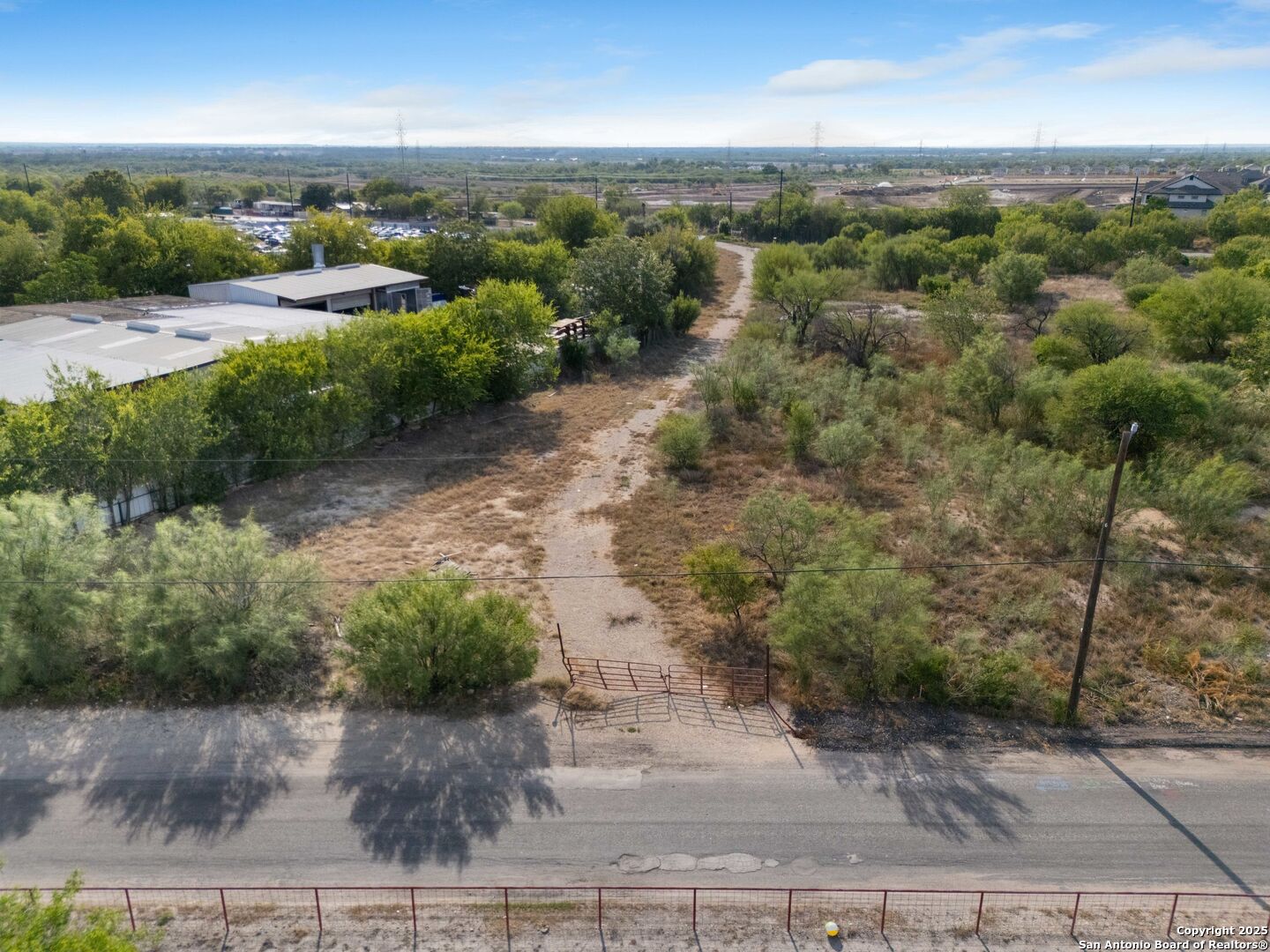 13348 Somerset Road Von Ormy, TX 78073 - Photo 8 of 13 a view of a big yard with green space