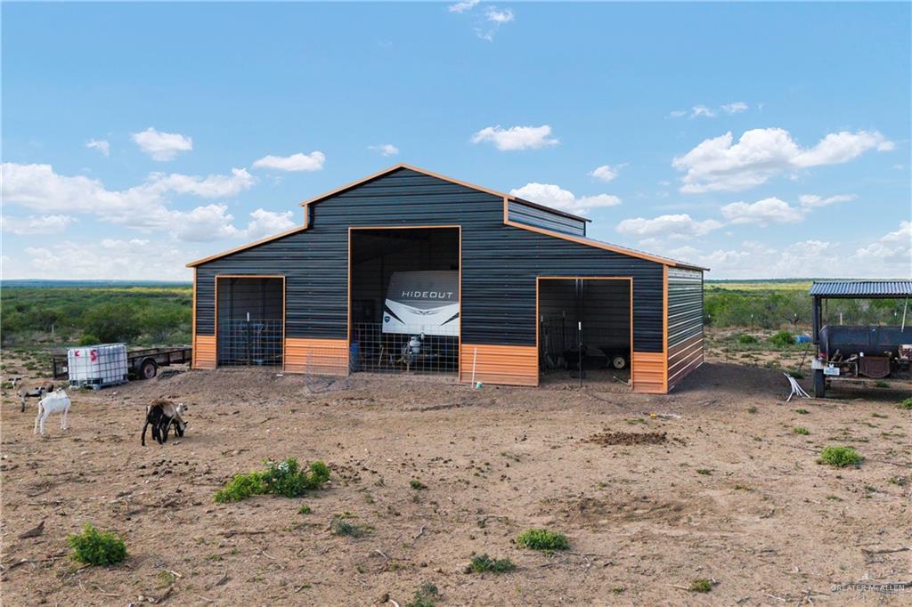 505 North Julian Road Roma, TX 78584 - Photo 2 of 13 a front view of a house with a yard