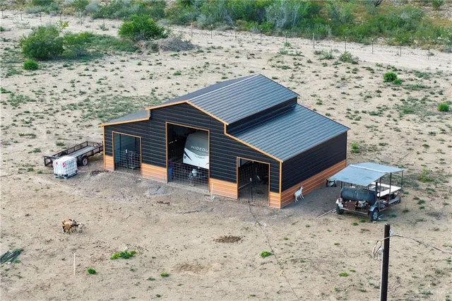 a wooden bench sitting in the middle of a yard