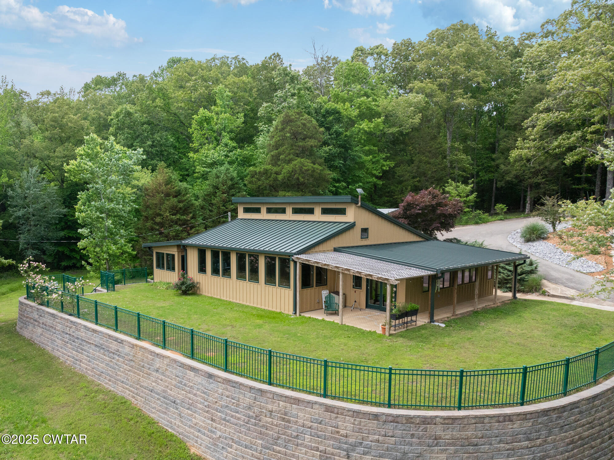 a view of a house with a backyard and a deck