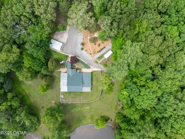 a backyard of a house with lots of green space