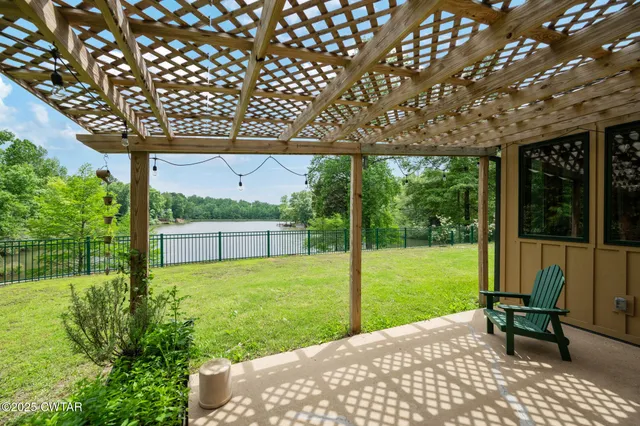 a kitchen with stainless steel appliances granite countertop a stove and a wooden cabinets
