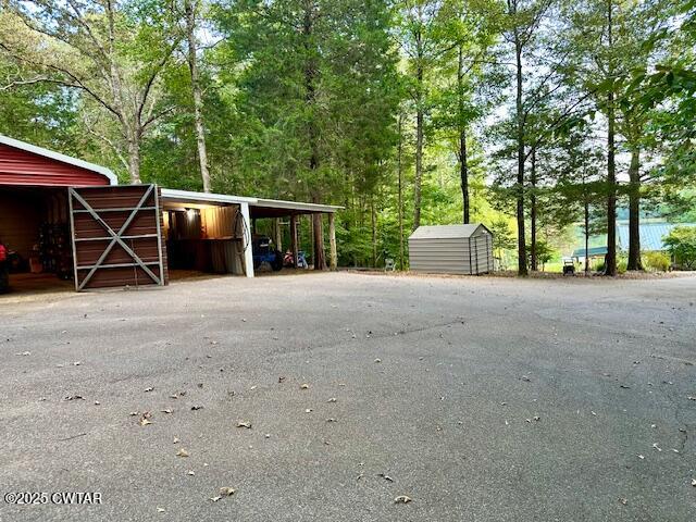 973 Old Lavinia Road Cedar Grove, TN 38321 - Photo 22 of 51 a view of a house with backyard and trees