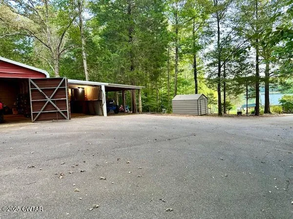 a kitchen with stainless steel appliances granite countertop a stove and a wooden cabinets