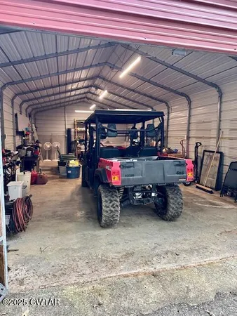 a view of walk in closet with clothes