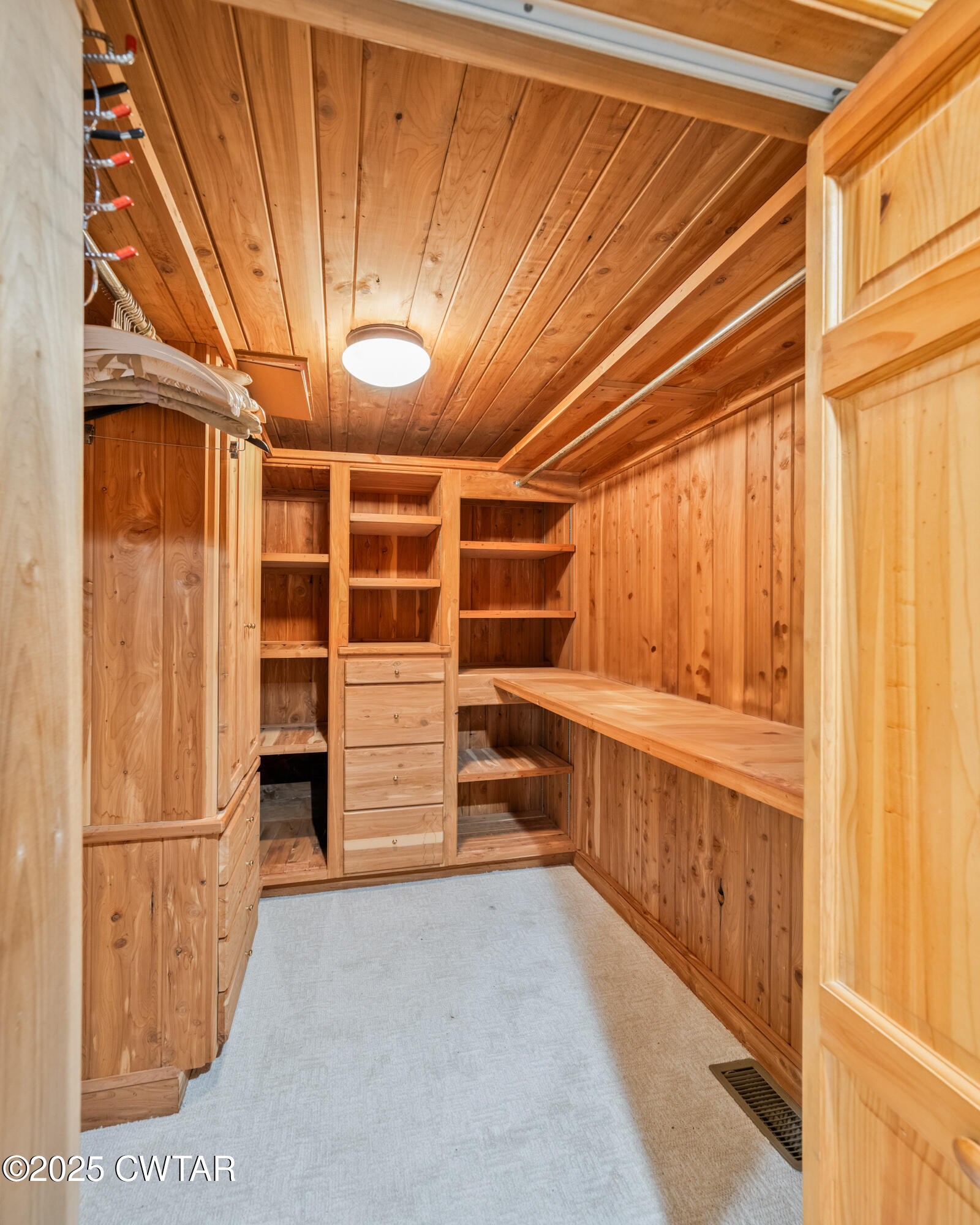 973 Old Lavinia Road Cedar Grove, TN 38321 - Photo 38 of 51 a view of walk in closet with clothes