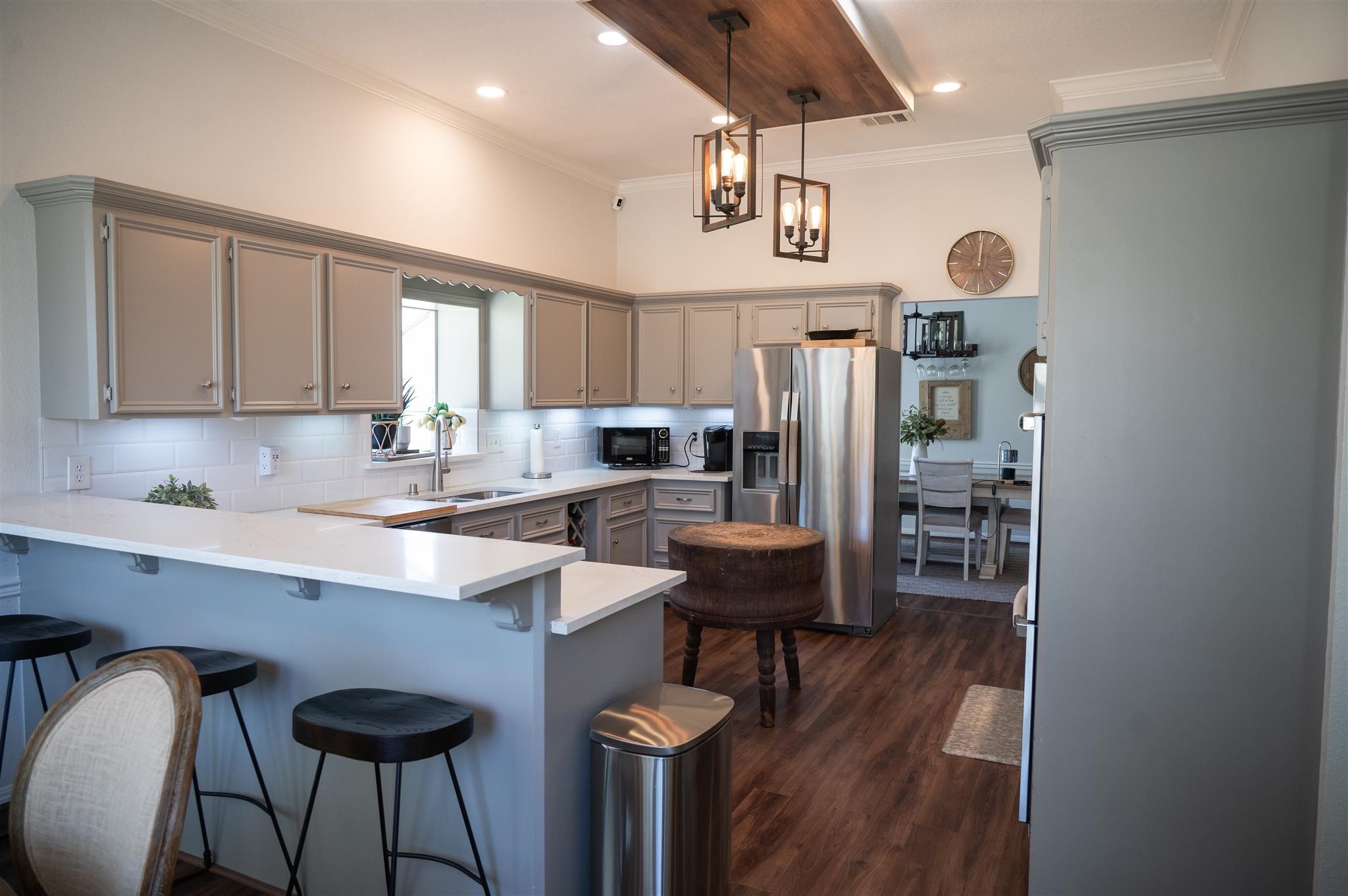 77 Panorama Drive Conroe, TX 77304 - Photo 17 of 49 a kitchen with stainless steel appliances a table chairs and a refrigerator