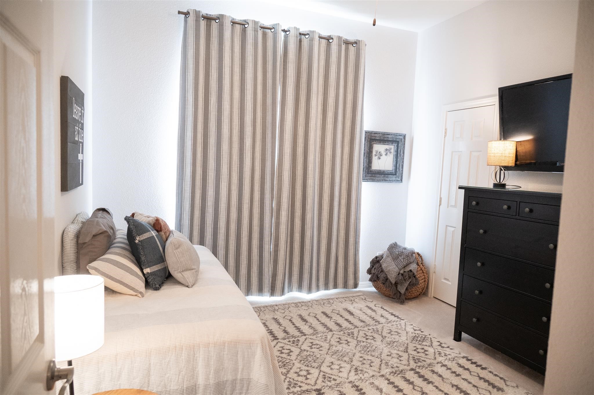 77 Panorama Drive Conroe, TX 77304 - Photo 33 of 49 a bedroom with a bed and a television