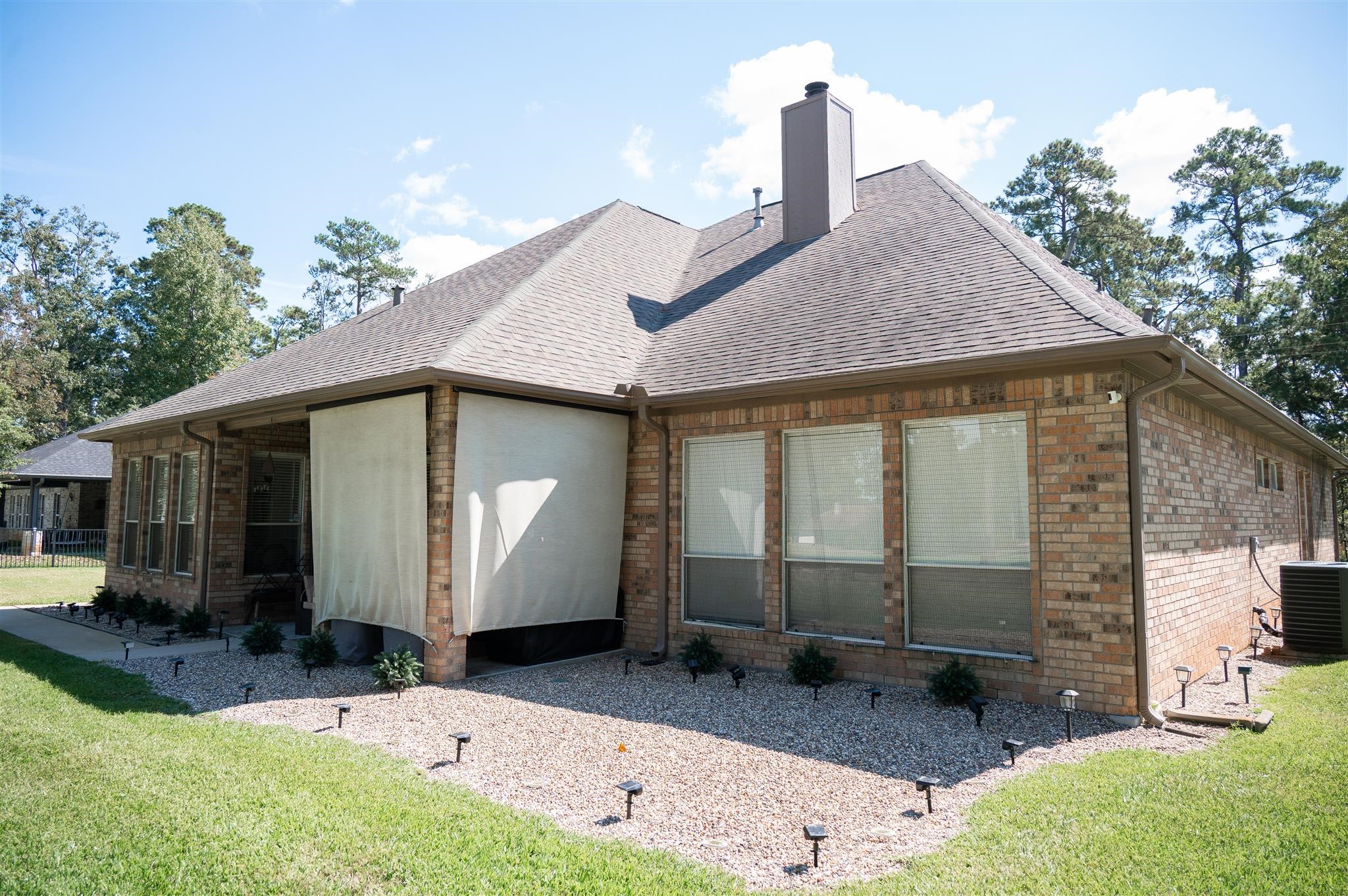 77 Panorama Drive Conroe, TX 77304 - Photo 38 of 49 a view of a house with backyard