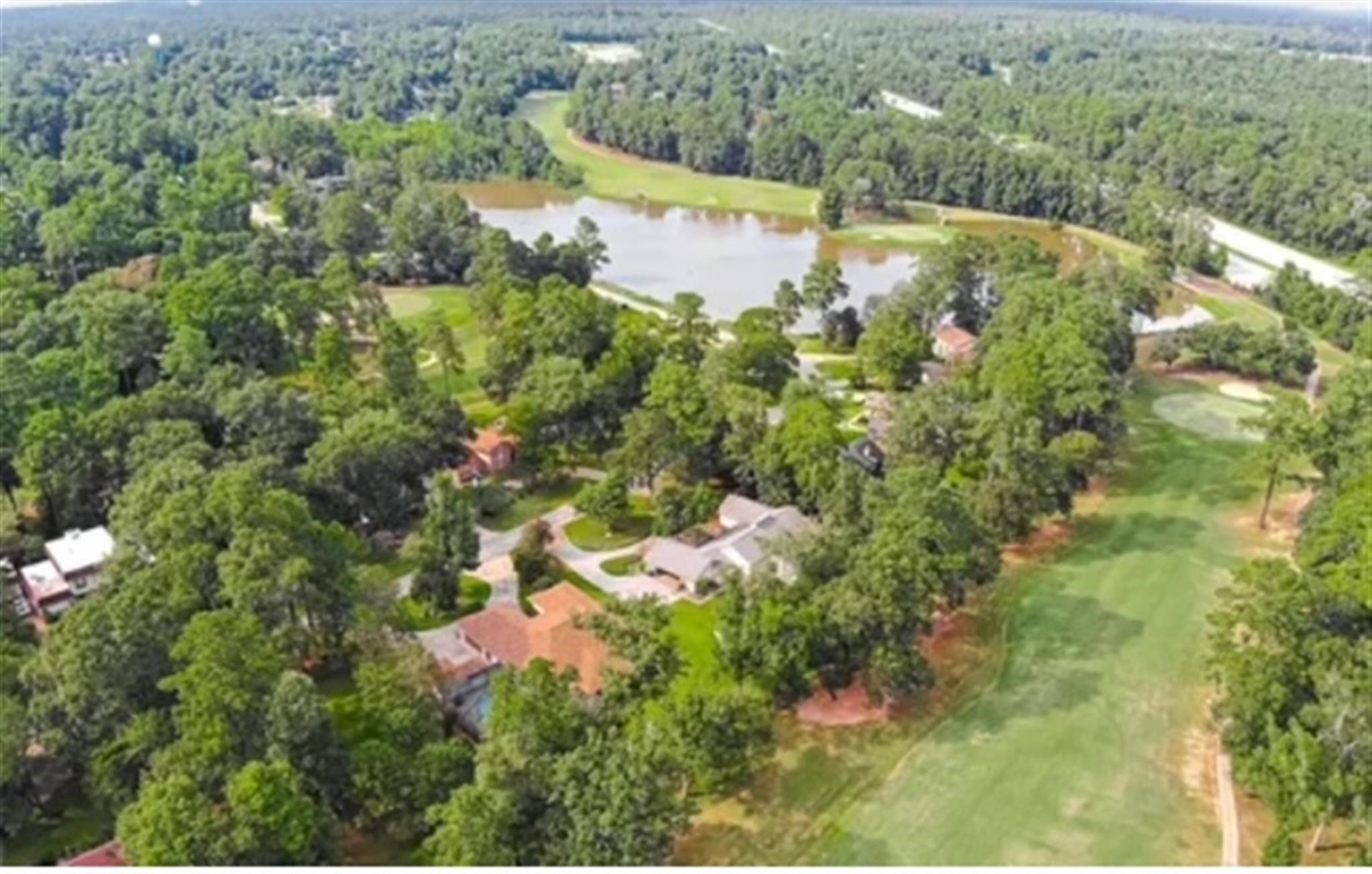 77 Panorama Drive Conroe, TX 77304 - Photo 41 of 49 a view of a lake with a yard