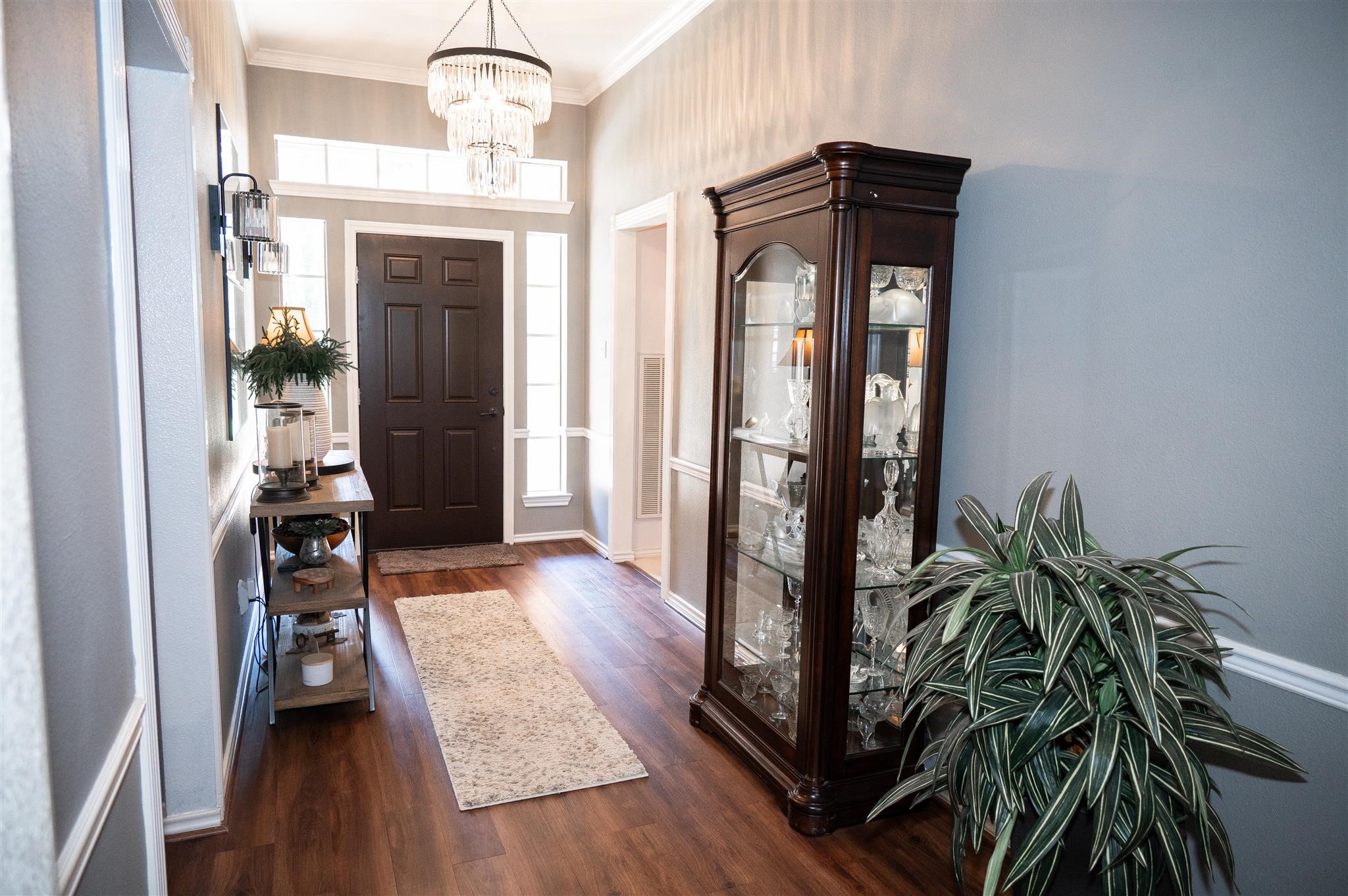 77 Panorama Drive Conroe, TX 77304 - Photo 7 of 49 a view of a hallway with wooden floor and stairs