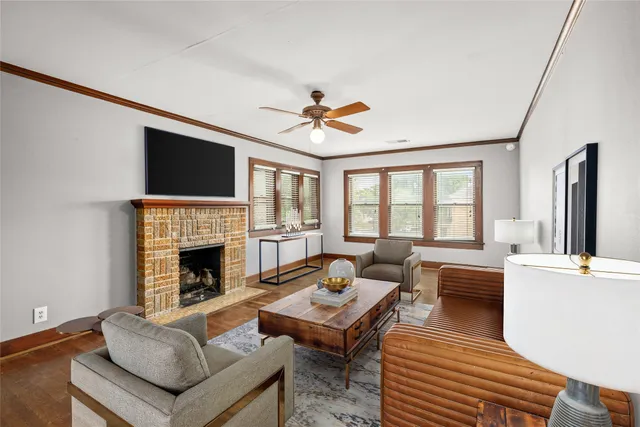 a living room with furniture fireplace and flat screen tv