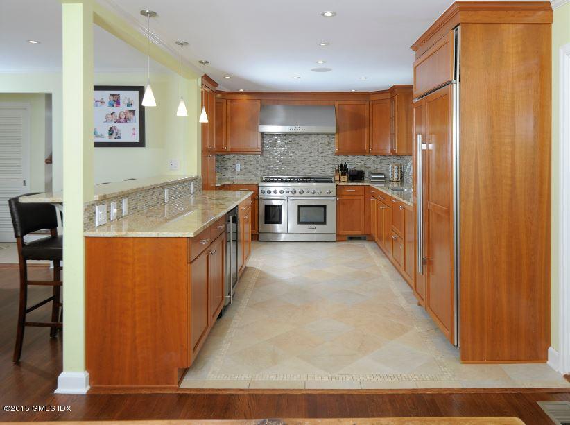 9 Bayside Terrace Riverside, CT 06878 - Photo 3 of 9 a large kitchen with stainless steel appliances a refrigerator and a stove