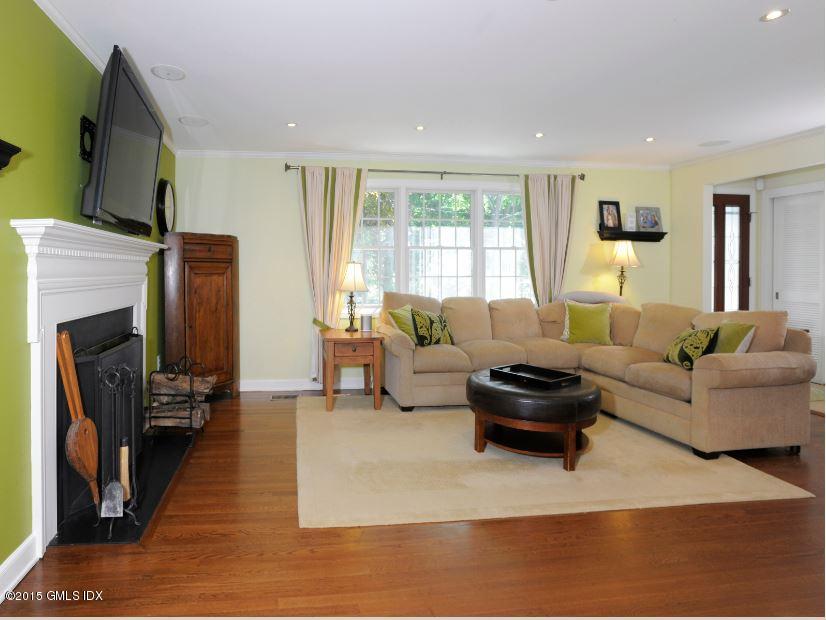 9 Bayside Terrace Riverside, CT 06878 - Photo 4 of 9 a living room with furniture and a fireplace