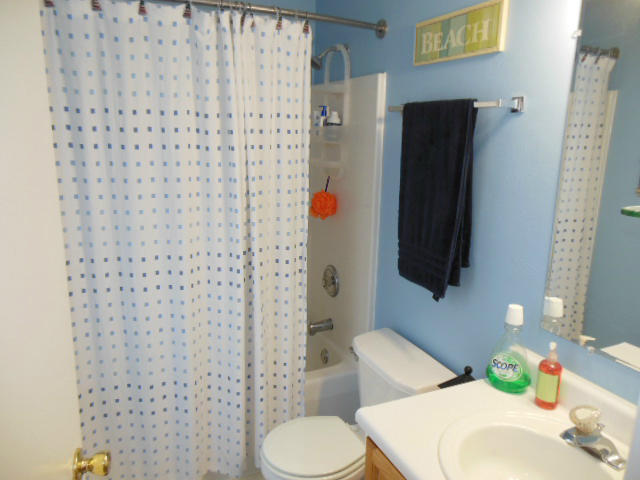 4751 West Westvale Road Northeast Roanoke, VA 24019 - Photo 12 of 25 a bathroom with a sink toilet and shower