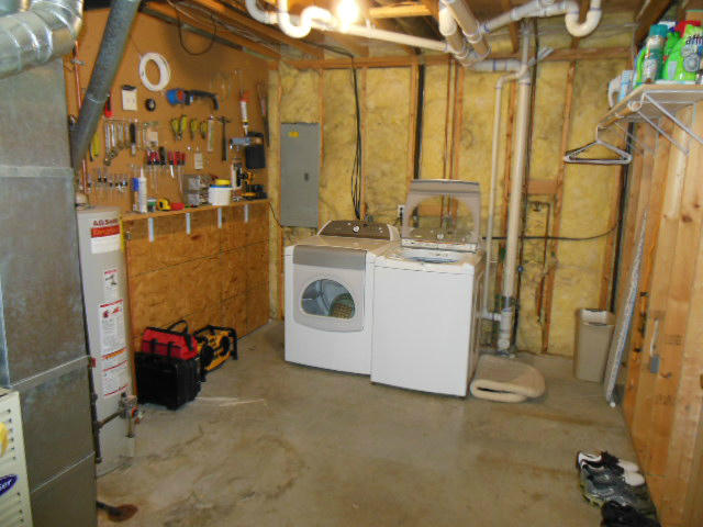 4751 West Westvale Road Northeast Roanoke, VA 24019 - Photo 18 of 25 a utility room with a refrigerator and washer