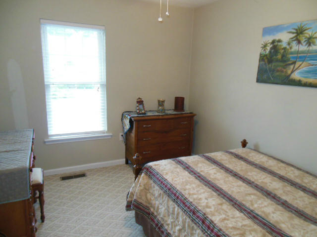 4751 West Westvale Road Northeast Roanoke, VA 24019 - Photo 10 of 25 a bedroom with a bed and a window