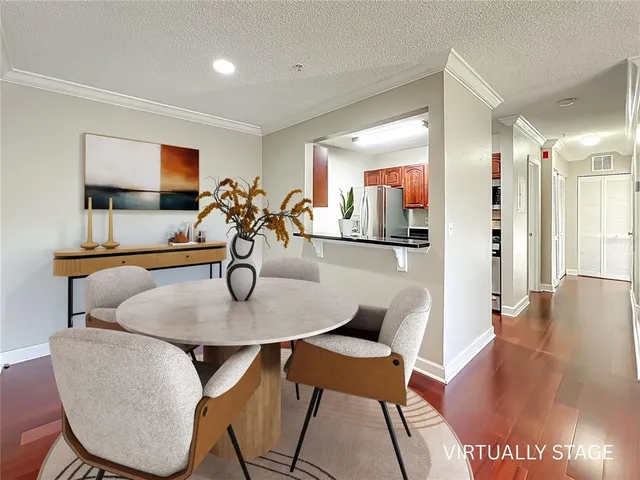 a dining room with furniture and a chandelier