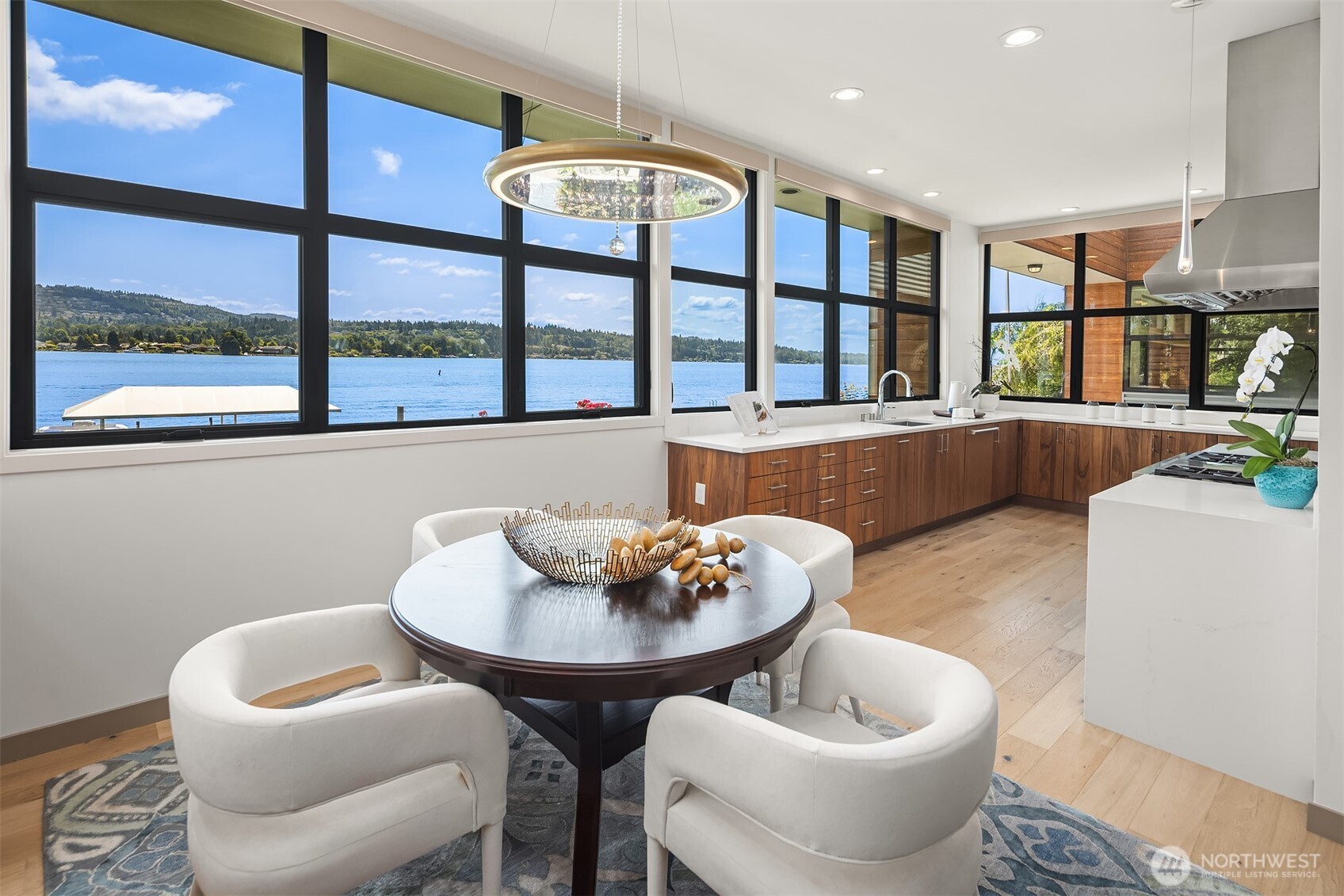 3840 East Mercer Way Mercer Island, WA 98040 - Photo 13 of 40 a living room with furniture and a potted plant
