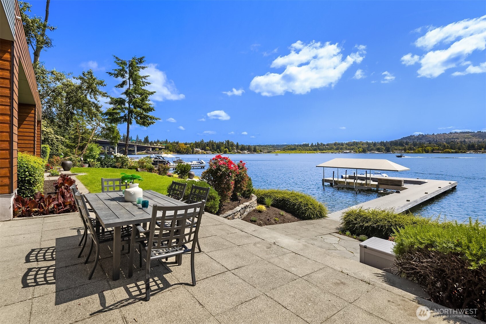 3840 East Mercer Way Mercer Island, WA 98040 - Photo 32 of 40 a view of a chairs and table in patio with a lake view