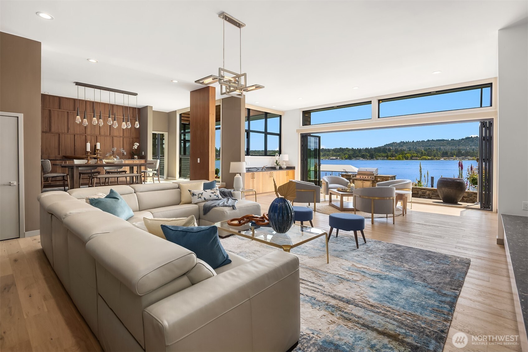 3840 East Mercer Way Mercer Island, WA 98040 - Photo 6 of 40 a living room with furniture and a chandelier