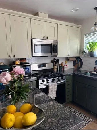a room with furniture and musical instruments