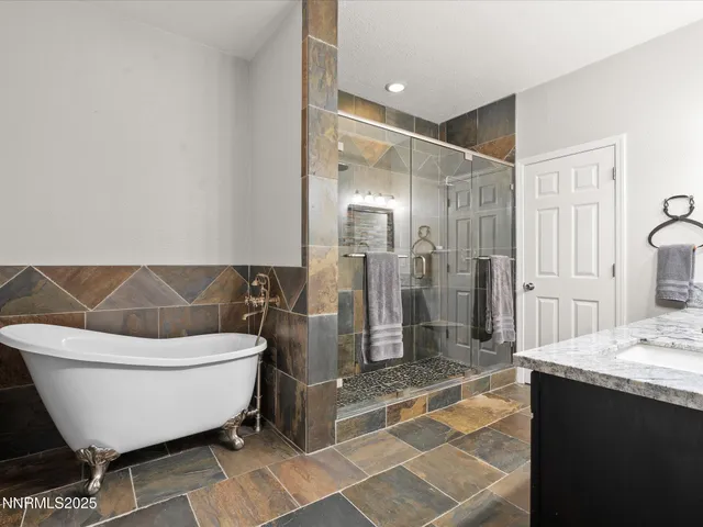 a bathroom with a double vanity sink and mirror