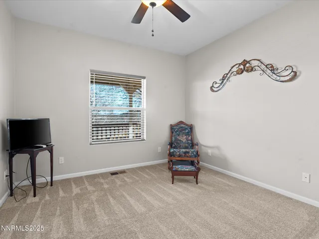 a spacious bedroom with a bed and window