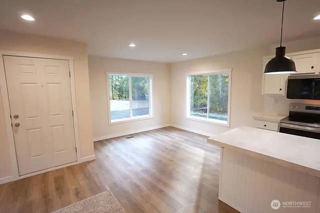 a kitchen with sink and window