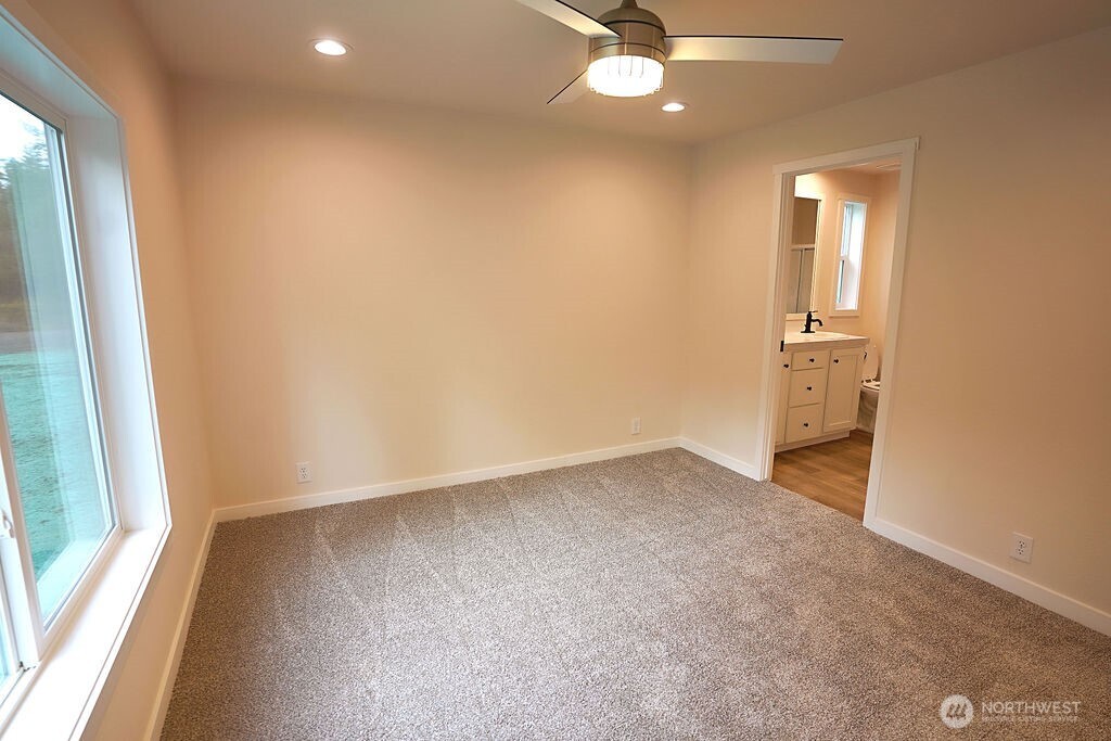 50 East Lookout Court Grapeview, WA 98546 - Photo 18 of 34 an empty room with a empty space and a window