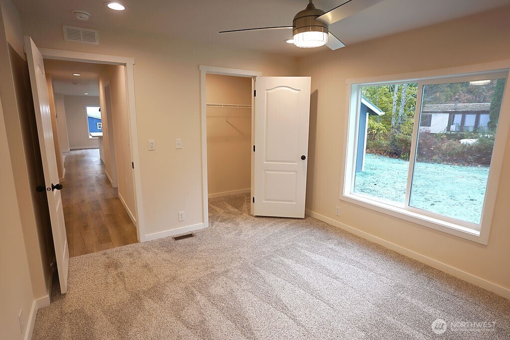 50 East Lookout Court Grapeview, WA 98546 - Photo 19 of 34 an empty room with fan and entrance