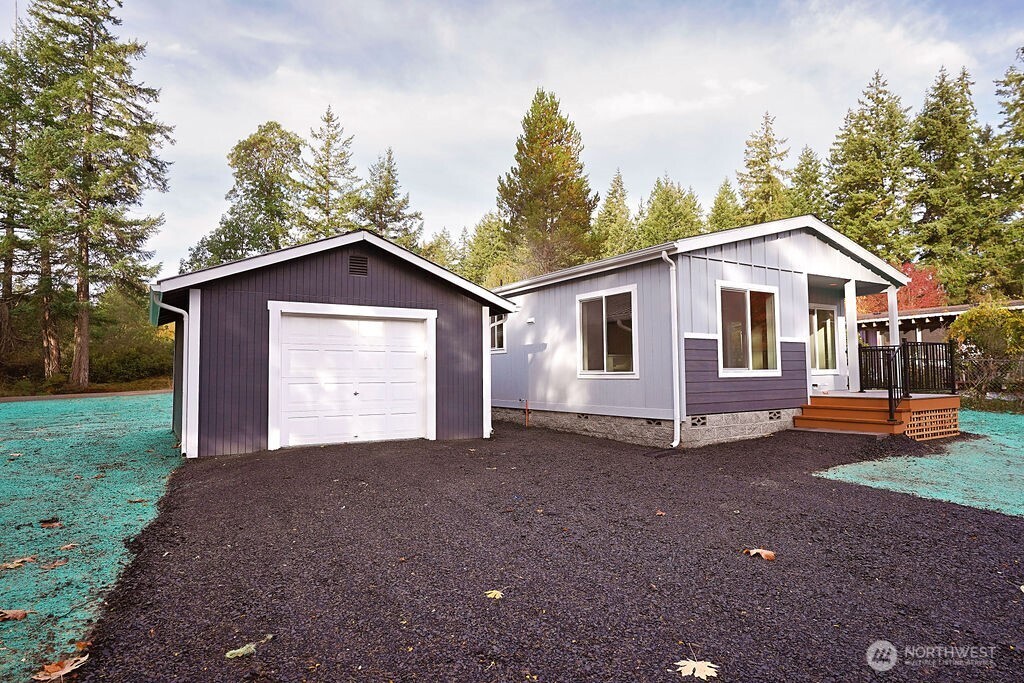 50 East Lookout Court Grapeview, WA 98546 - Photo 2 of 34 a view of a house with a yard