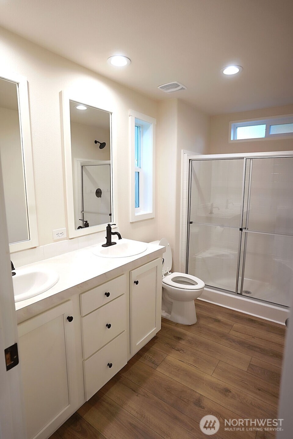 50 East Lookout Court Grapeview, WA 98546 - Photo 26 of 34 a bathroom with a double vanity sink a toilet and a mirror