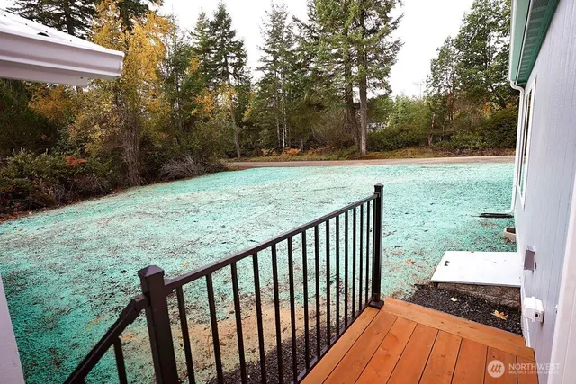 a backyard of a house with wooden fence