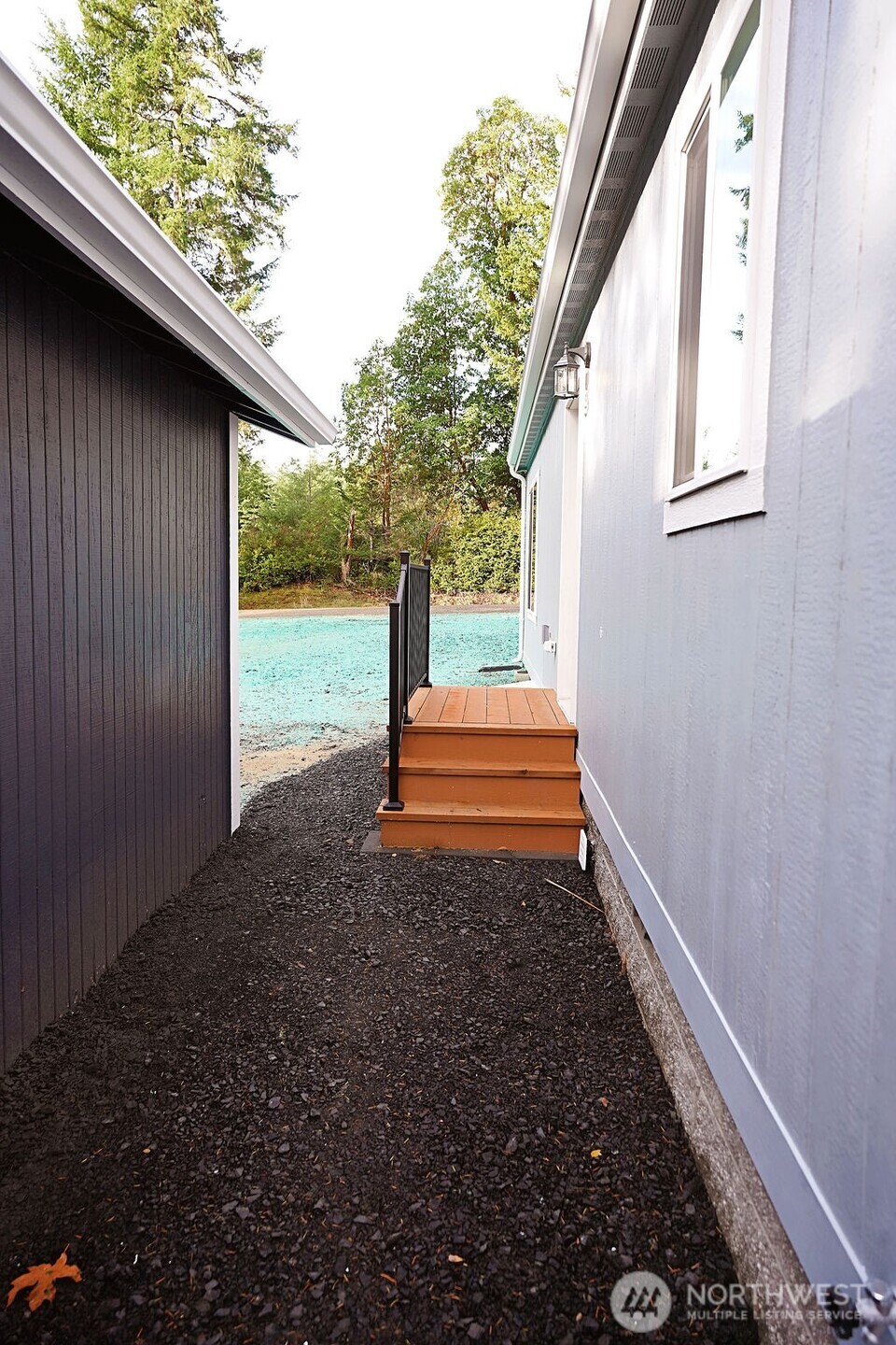 50 East Lookout Court Grapeview, WA 98546 - Photo 30 of 34 a backyard of a house with wooden fence