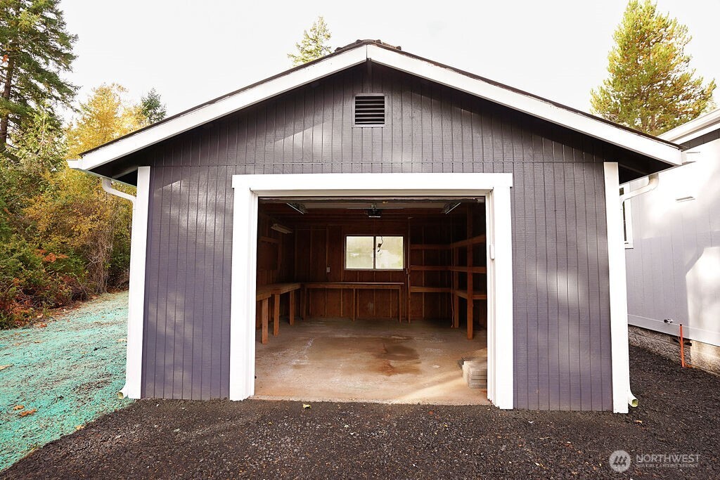 50 East Lookout Court Grapeview, WA 98546 - Photo 31 of 34 a front view of a house with garden