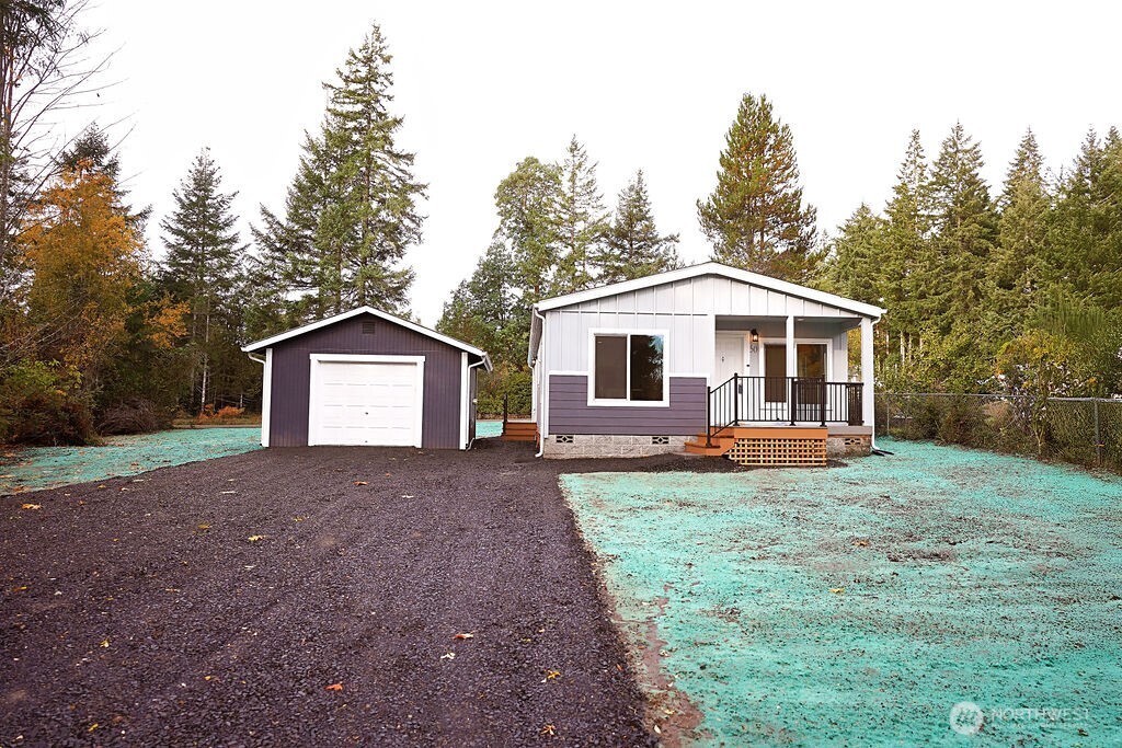 50 East Lookout Court Grapeview, WA 98546 - Photo 34 of 34 a front view of a house with yard
