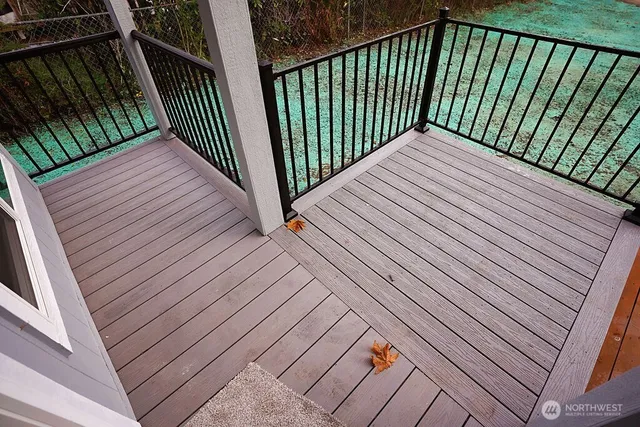 a view of a balcony with wooden floor