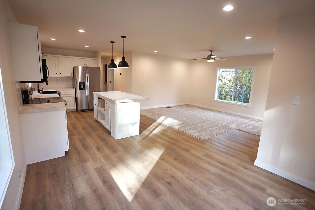 50 East Lookout Court Grapeview, WA 98546 - Photo 7 of 34 a view of a kitchen with furniture and a window