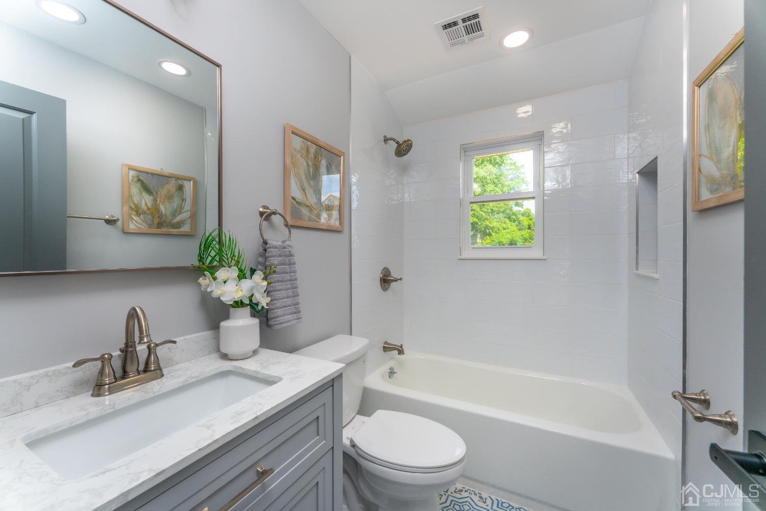 45 East Cliff Road Colonia, NJ 07067 - Photo 14 of 31 a bathroom with a granite countertop sink a toilet and shower