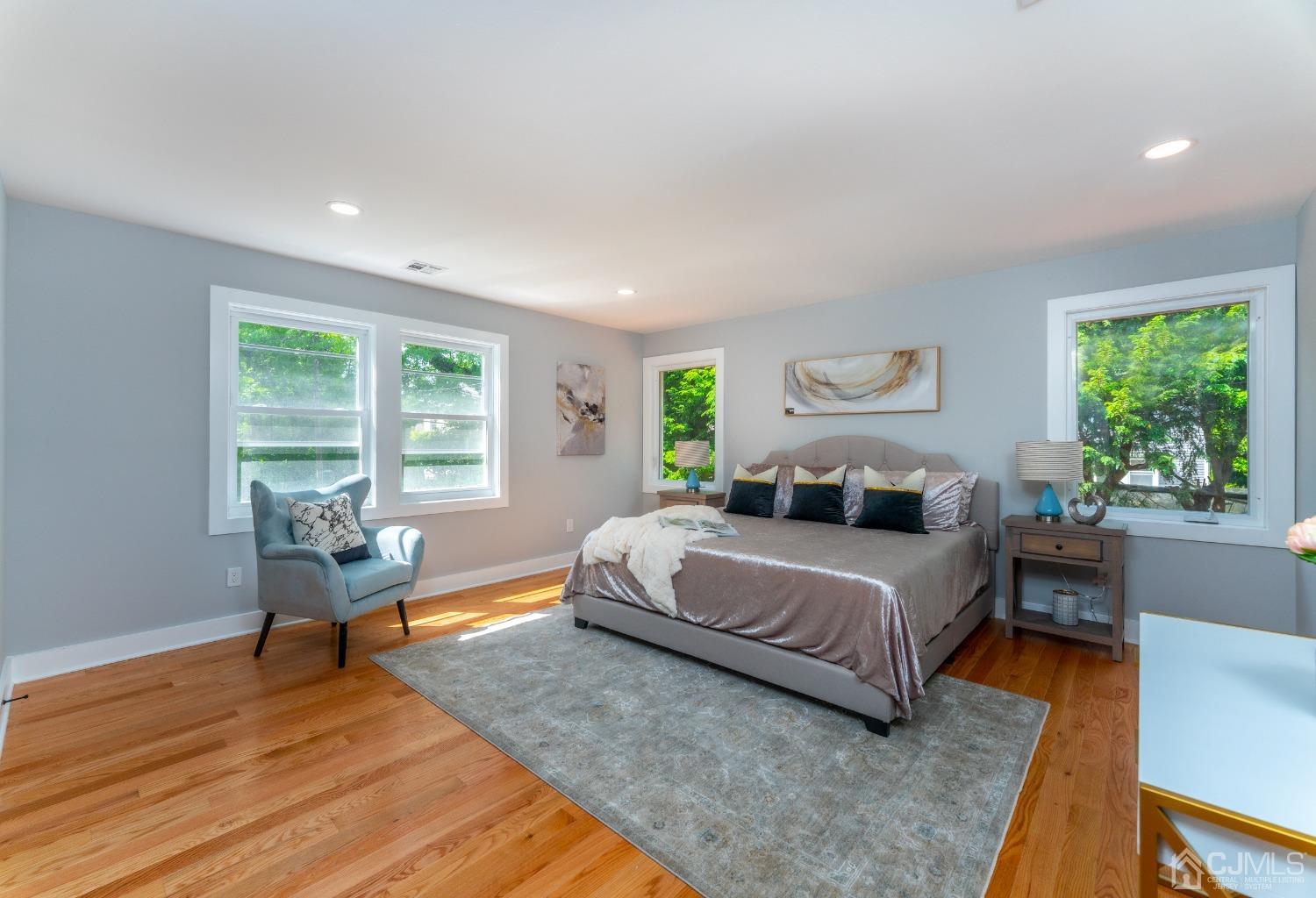 45 East Cliff Road Colonia, NJ 07067 - Photo 15 of 31 a bedroom with a bed and wooden floor
