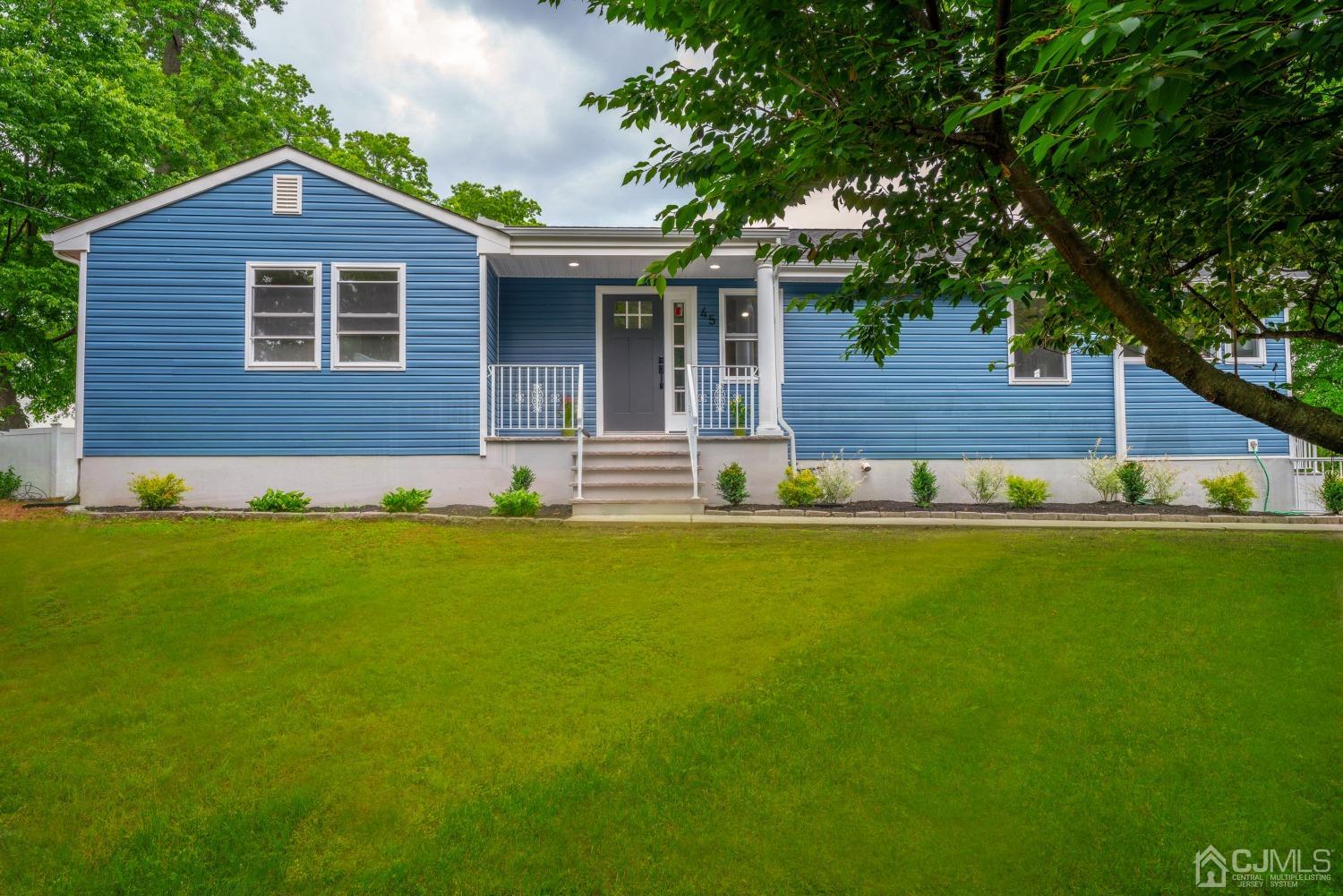 45 East Cliff Road Colonia, NJ 07067 - Photo 2 of 31 a front view of a house with a yard